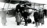 Летчик В.С.Веселовский (третий слева) у своего "Бранденбурга". Зима 1918 - 1919 г.